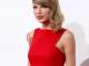 [Taylor Swift posing for photos in a red dress]